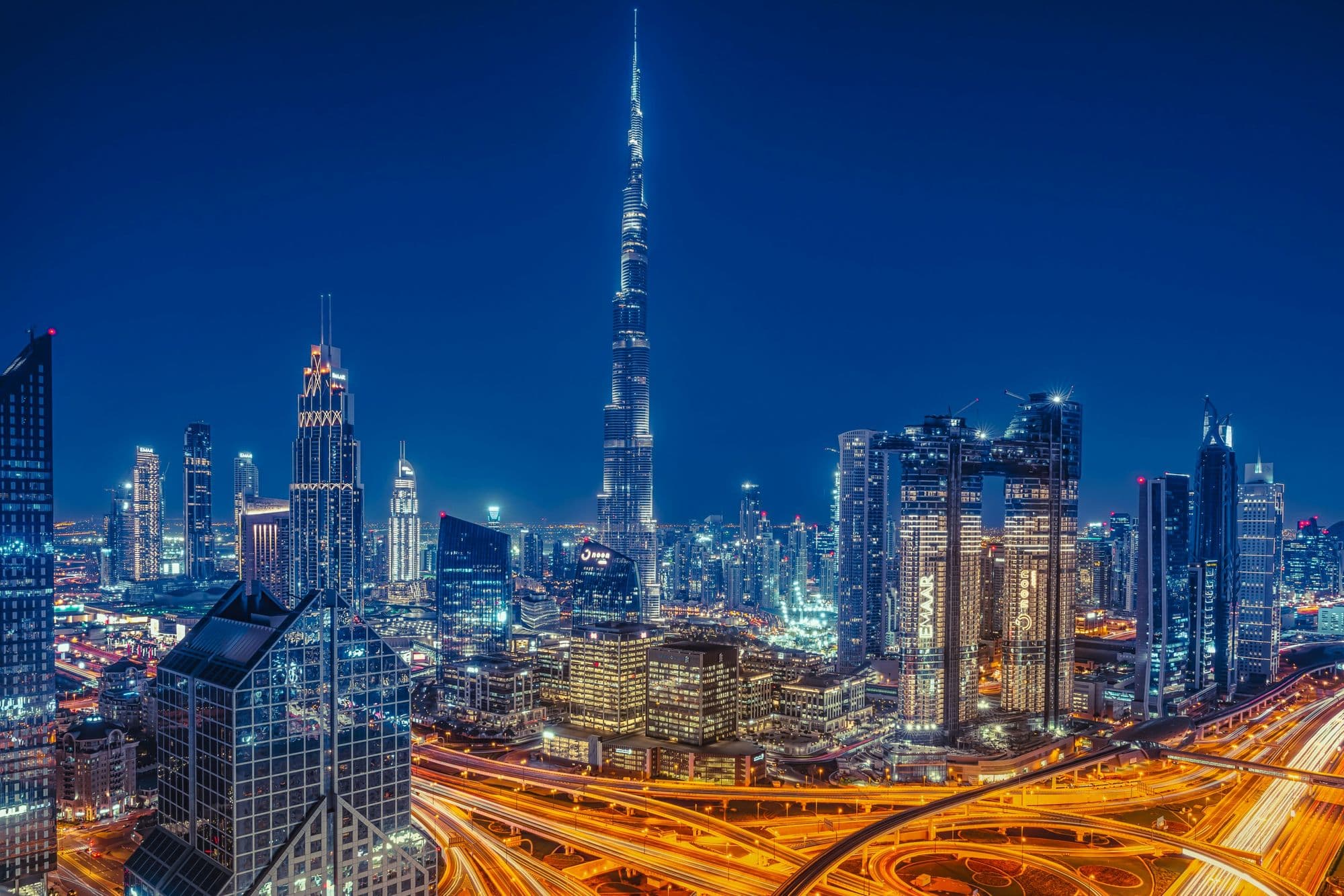 Downtown Dubai at night, the Burj Khalifa above lit traffic on Sheikh Zayed Road